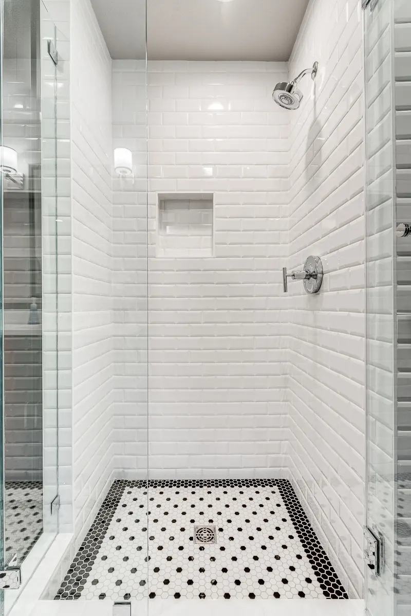 McKinney bathroom remodel idea: walk-in shower in white subway tile with a mosaic floor