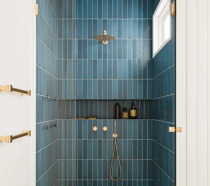 North Richland Hills bathroom remodel idea: tub to shower conversion in deep blue tile with gold fixtures