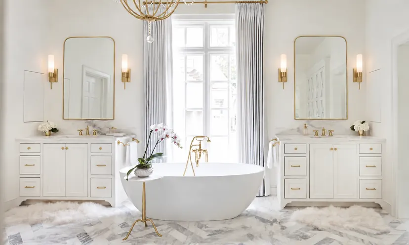 Plano bathroom remodel idea: master bathroom with a freestanding tub between twin white vanities
